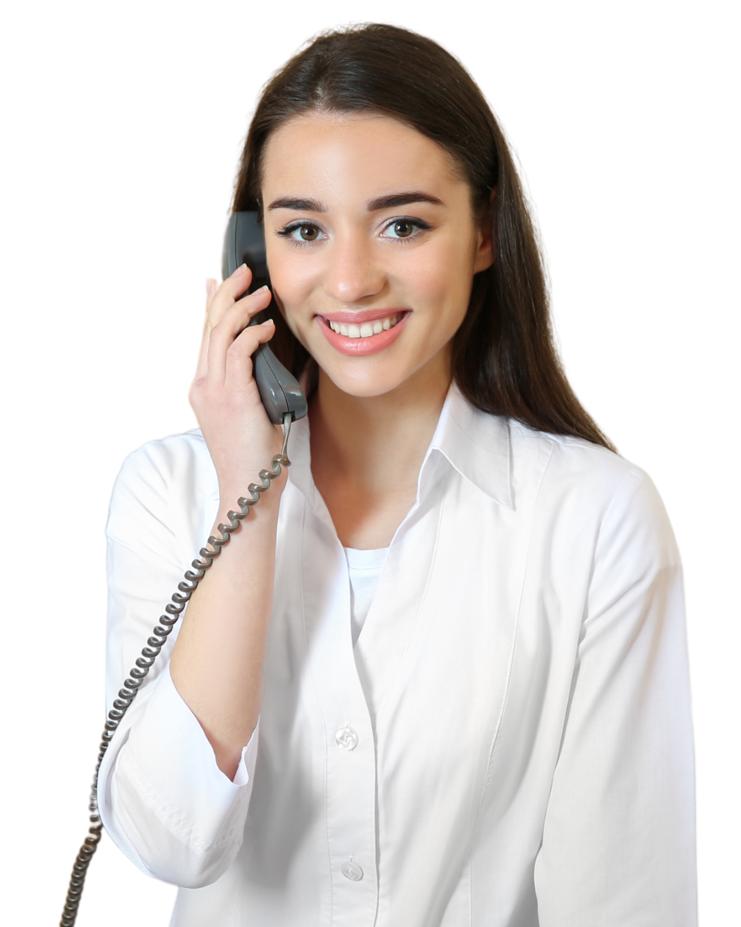 A clinic receptionist speaking with a patient by phone.